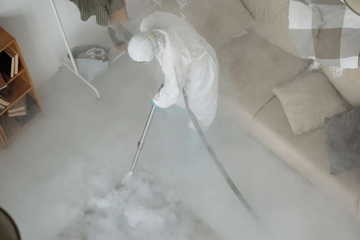 Biohazard cleanup technician in protective equipment, Greenland Hills, Dallas, TX